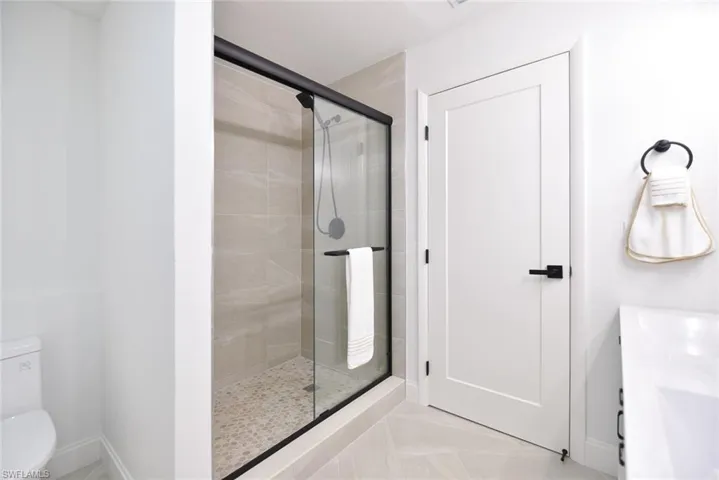 Full bath with vanity and a stall shower