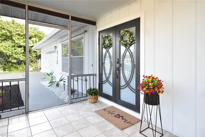 Entrance to property with french doors and a sunroom