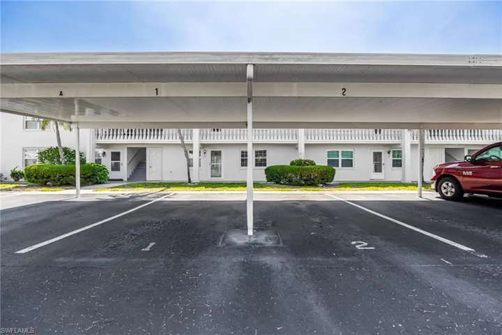 Covered parking lot featuring stairs
