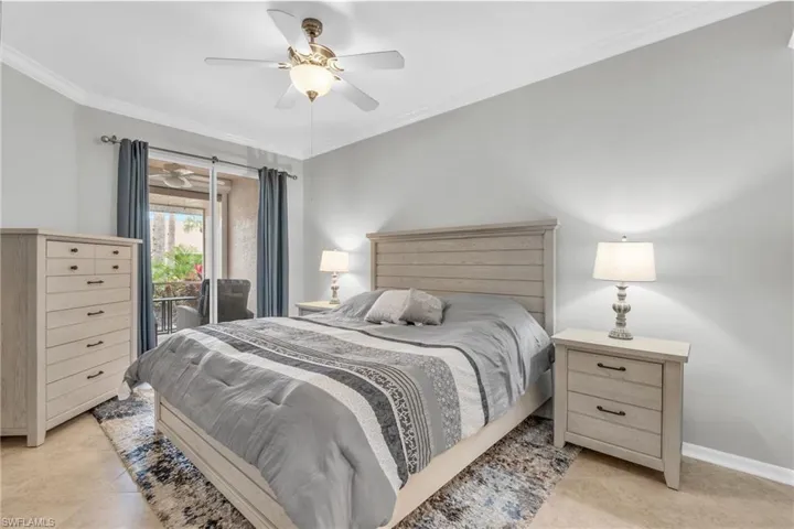 Bedroom featuring ceiling fan, access to exterior, ornamental molding, and light tile patterned flooring