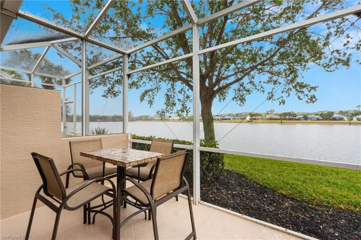 Sunroom with a water view