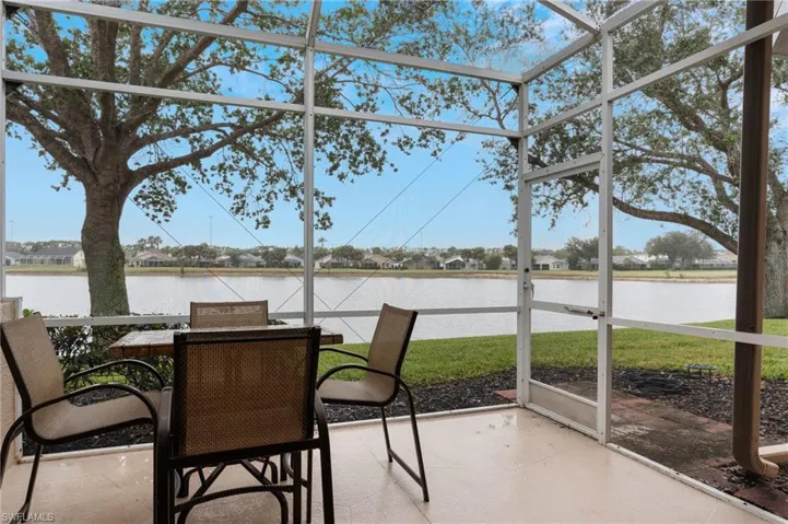 Sunroom with a water view