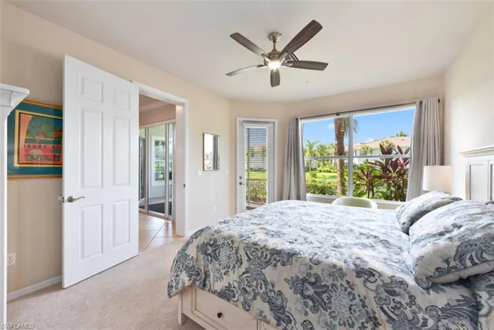 Bedroom featuring access to outside, light colored carpet, and ceiling fan