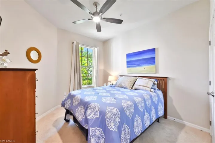 Bedroom featuring carpet floors and ceiling fan