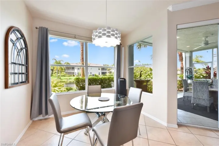 Dining area featuring light tile patterned floors and ceiling fan