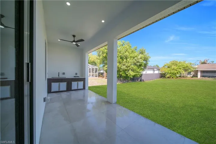 View of patio featuring ceiling fan and a sink