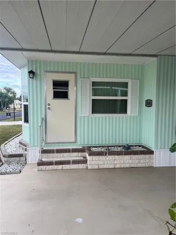 Property entrance with a porch