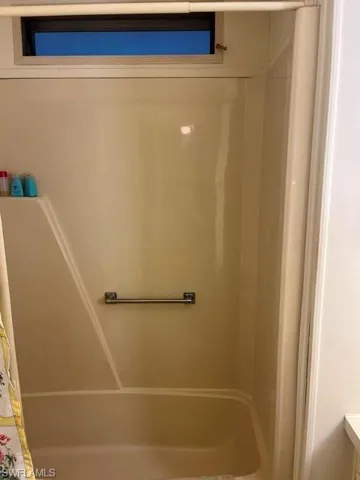 Full bathroom featuring a shower with curtain