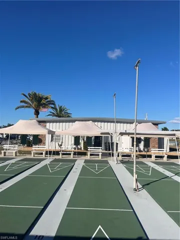 View of property's community with shuffleboard