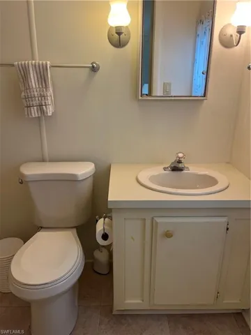 Bathroom featuring vanity and light tile patterned floors