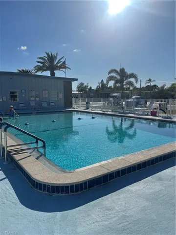 Community pool with a patio area