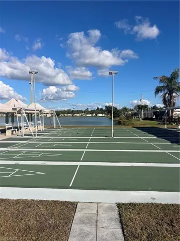 View of property's community featuring shuffleboard