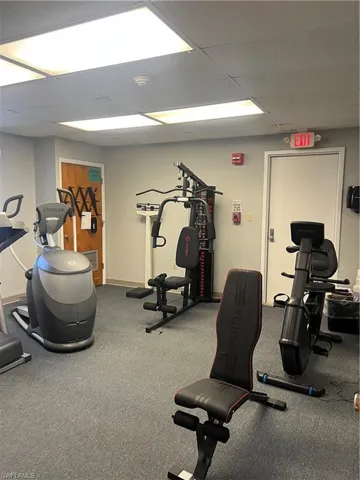 Gym with a paneled ceiling