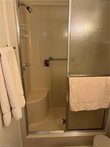 Full bath featuring a stall shower