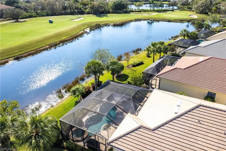Drone / aerial view of a large body of water and a golf course