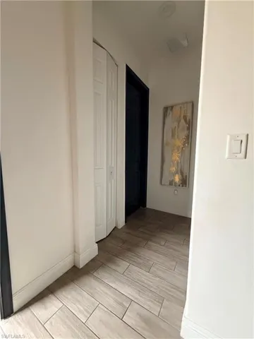 Wood-look tile flooring extends through this interior hallway