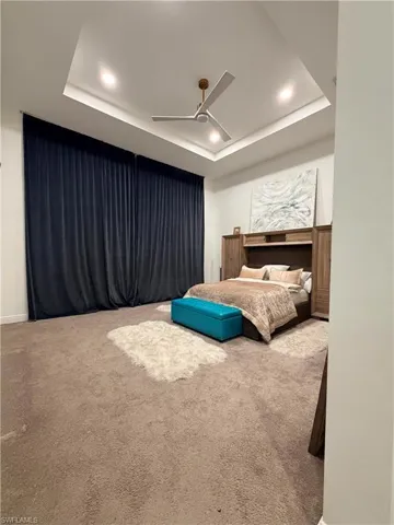 Recessed ceiling with integrated lighting and a modern ceiling fan