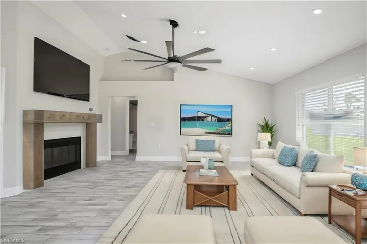 Photo includes reality renovation and/or staging to showcase the possibility of the living room. Design services included with purchase!