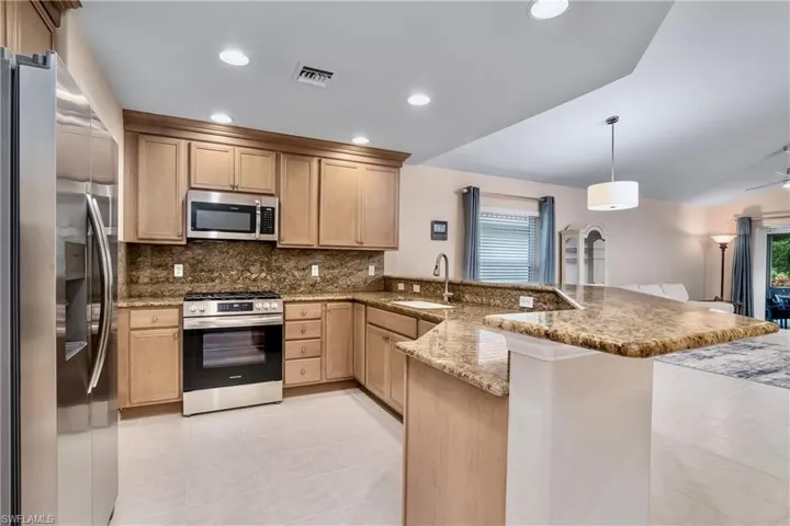 New appliances.  Real wood cabinets.  Granite countertops with matching backsplash.