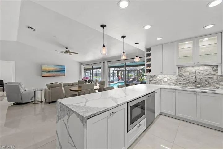 Open kitchen/living with vaulted ceilings