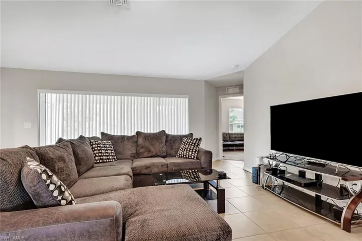 Living area featuring light tile patterned floors