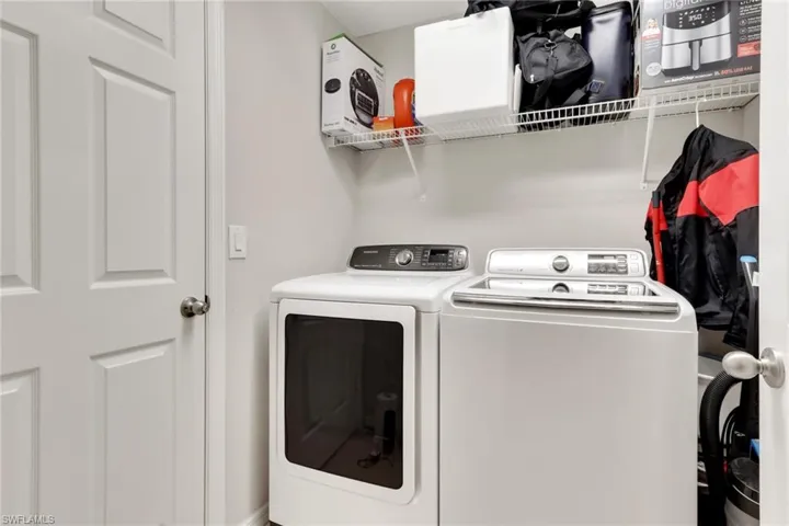 Laundry area with washer and clothes dryer
