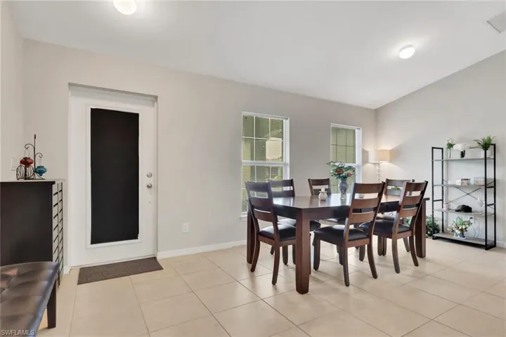 Dining room featuring light tile patterned flooring