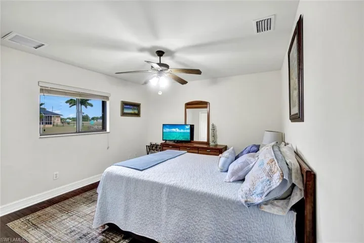 Bedroom featuring wood finished floors and a ceiling fan
