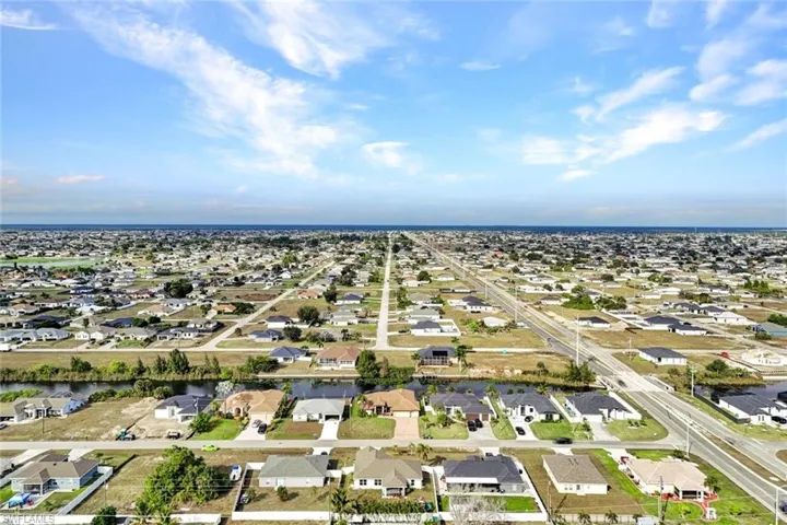 View of property location featuring nearby suburban area and a nearby body of water