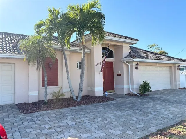 View of front of property with a garage