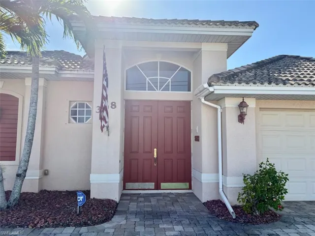 View of exterior entry featuring a garage