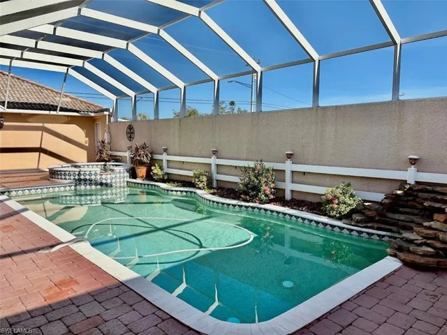View of pool with a lanai