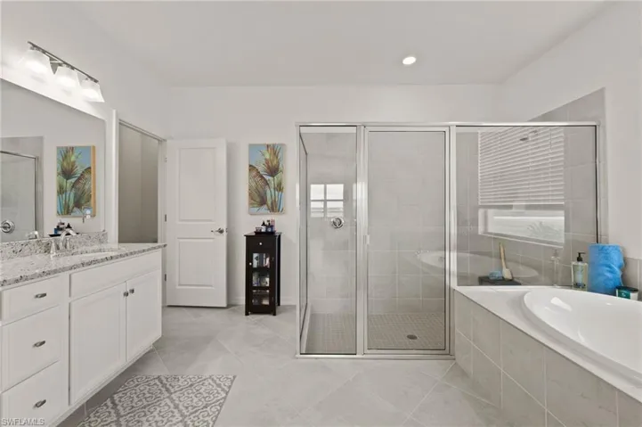 Sizable Master Bathroom with private water closet