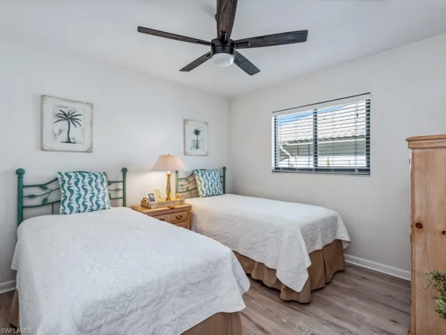 Bedroom featuring light hardwood / wood-style floors and ceiling fan