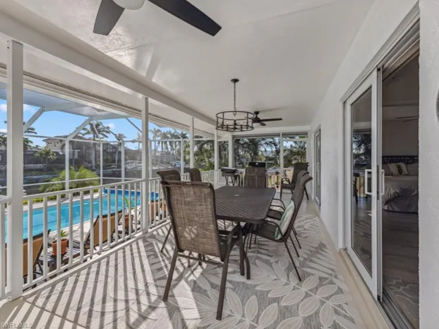 Sunroom / solarium featuring ceiling fan and plenty of natural light