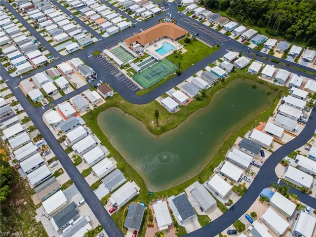 Aerial view of property's location with a large body of water