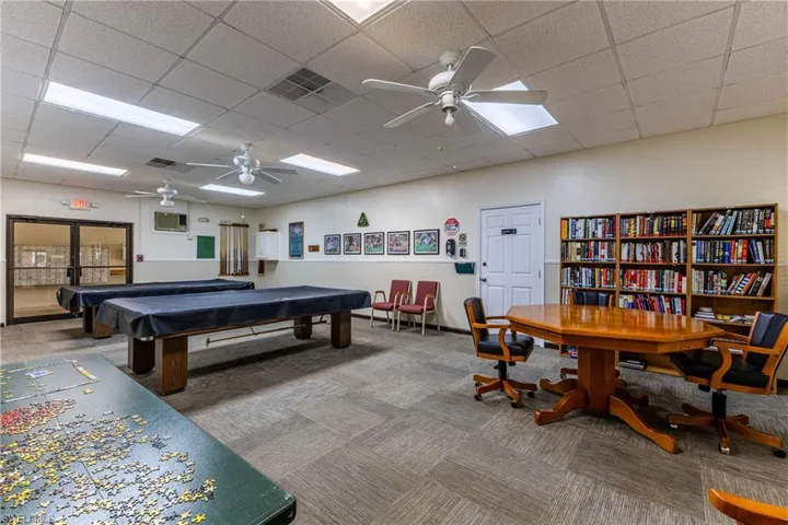 Game room featuring carpet floors, a ceiling fan, pool table, and a drop ceiling