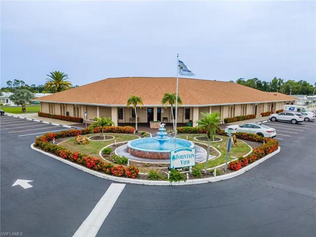 View of property with uncovered parking