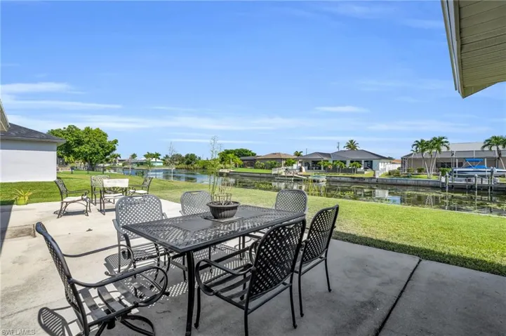 View of patio / terrace featuring a boat dock and a water view