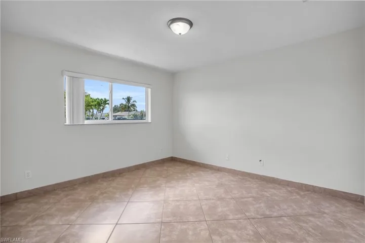 Unfurnished room with tile patterned floors