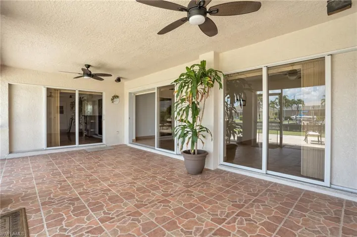 View of patio featuring ceiling fan