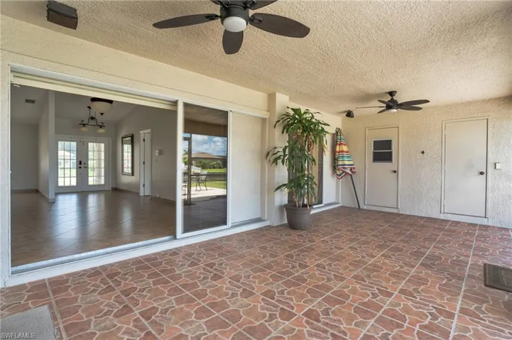 View of patio featuring ceiling fan