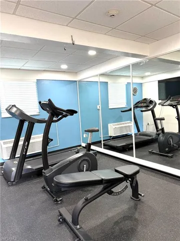 Exercise room featuring a drop ceiling