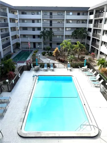 Community pool featuring a patio area