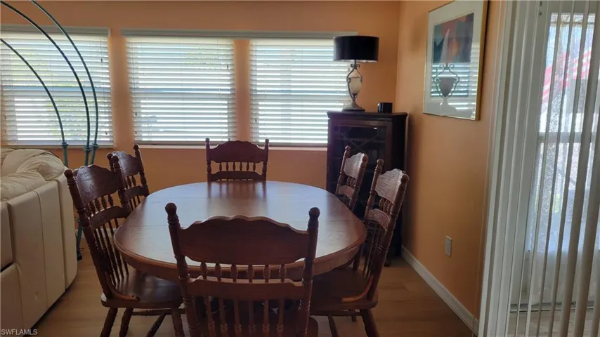 Dining room with  vinyl finished floors and baseboards