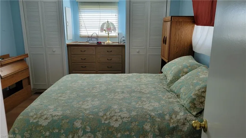 Bedroom featuring multiple closets