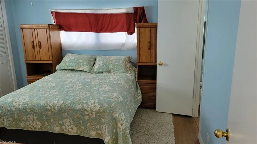 Bedroom with vinyl finished floors