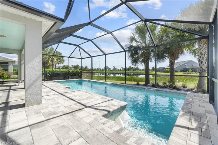 Screened saltwater swimming pool and paver deck. 16160 Bluestem Ln. Babcock Ranch, FL 33982