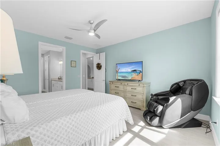 ceiling fan, tile flooring, and two interior doorways. 16160 Bluestem Ln. Babcock Ranch, FL 33982