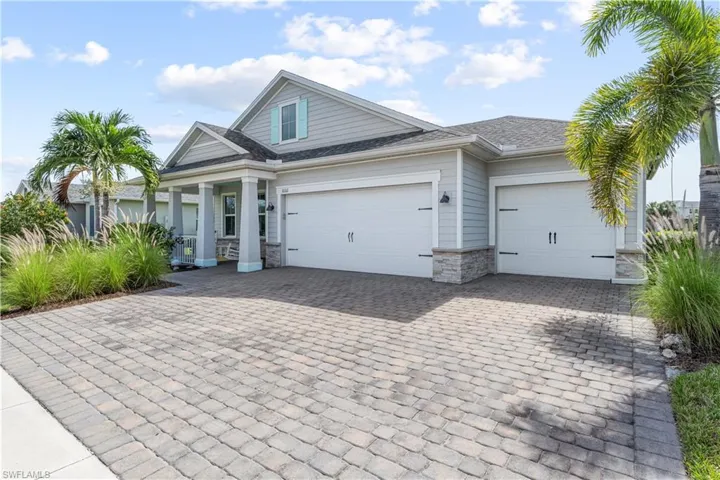Paved driveway with 3 Car Garage. 16160 Bluestem Ln. Babcock Ranch, FL 33982